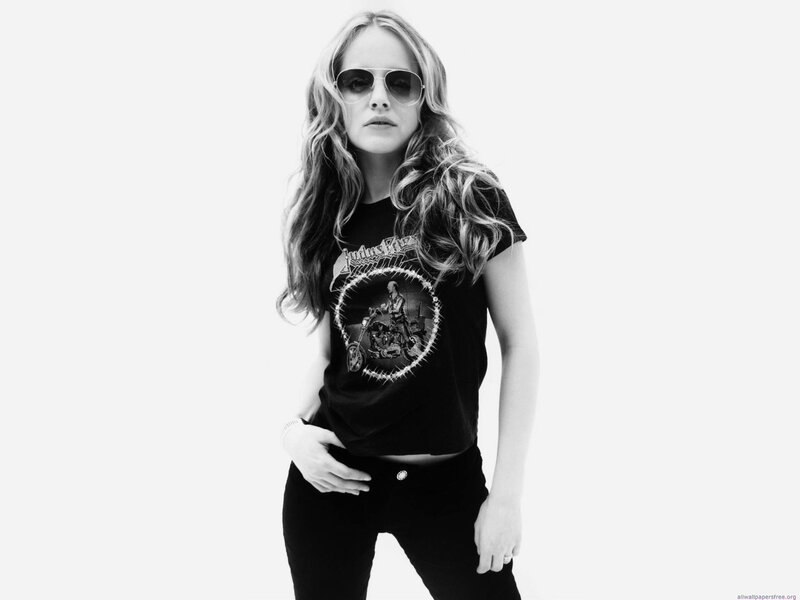 woman in sunglasses and band t-shirt