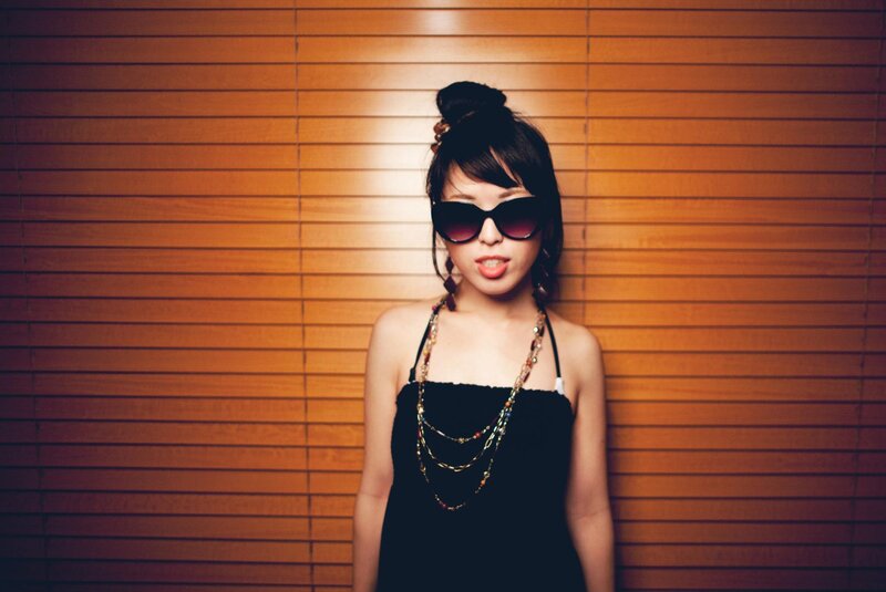 woman in sunglasses and black dress