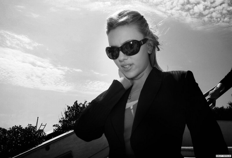 woman in sunglasses and blazer