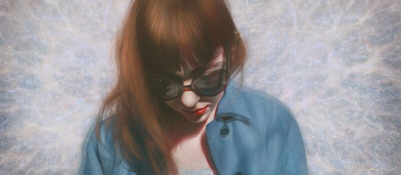 woman in sunglasses and blue jacket