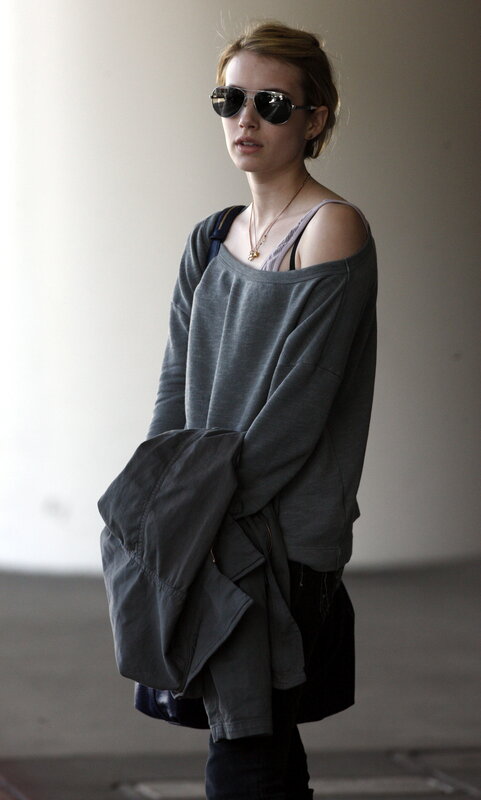 woman in sunglasses and gray sweater