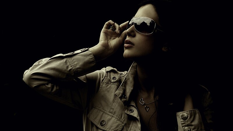 woman in sunglasses and jacket