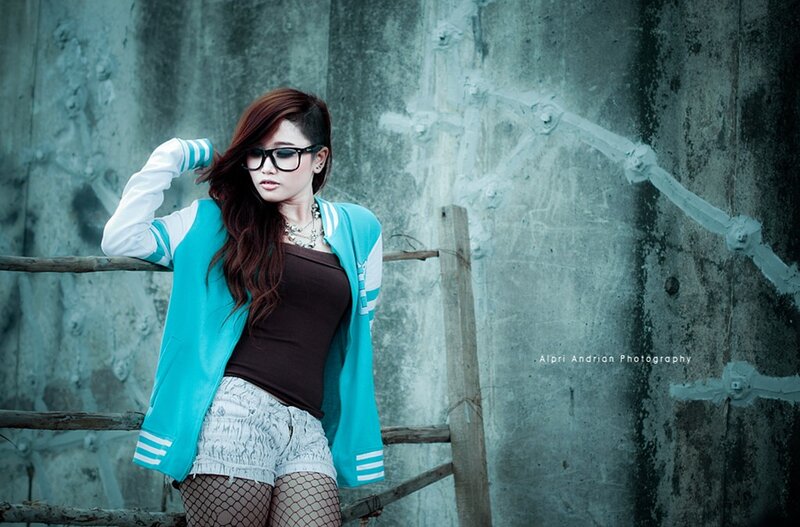 woman in sunglasses and jacket