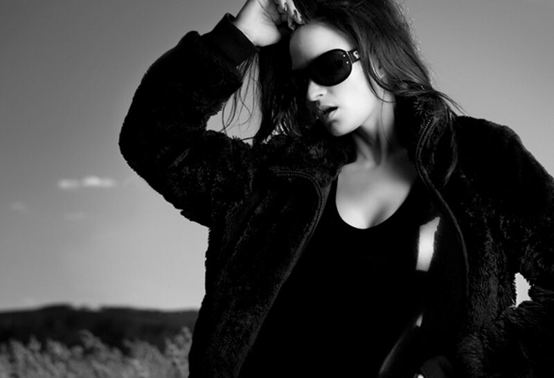 woman in sunglasses and jacket