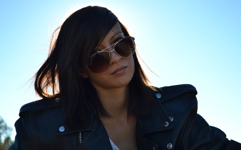 woman in sunglasses and leather jacket