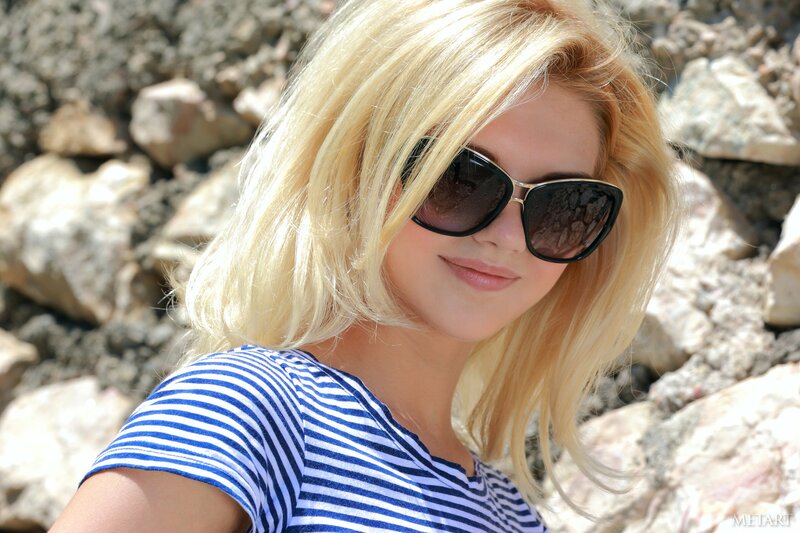 woman in sunglasses and striped shirt
