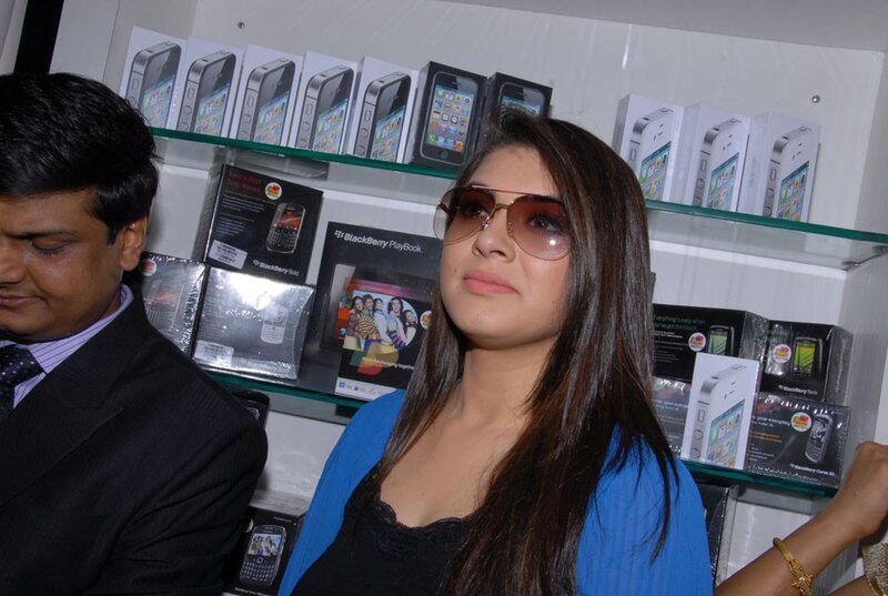 woman in sunglasses at electronics store