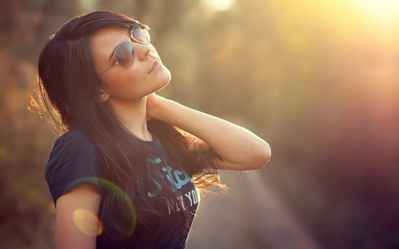 woman in sunglasses at sunset