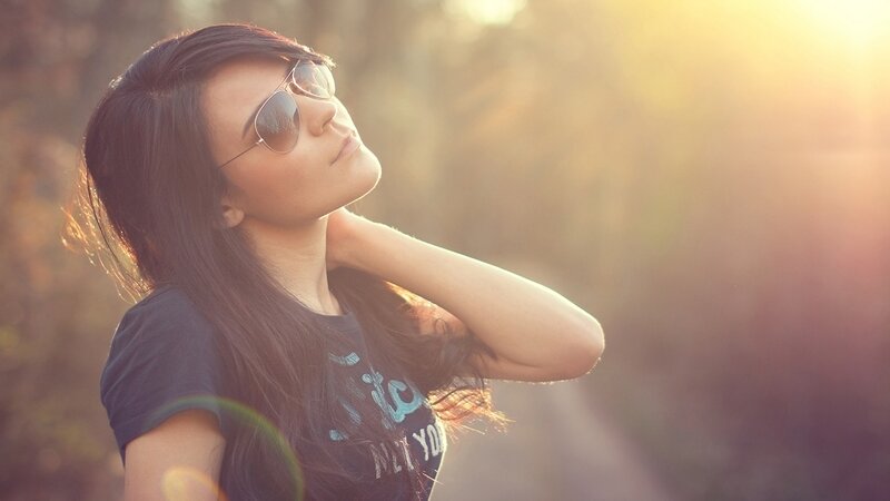 woman in sunglasses at sunset