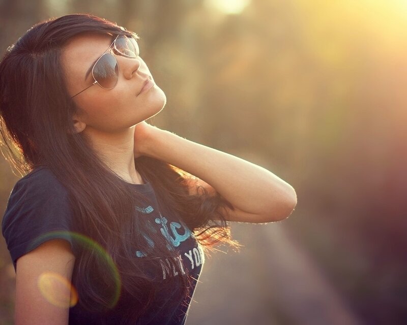 woman in sunglasses at sunset