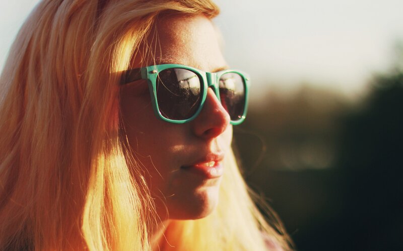 woman in sunglasses at sunset