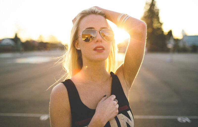 woman in sunglasses at sunset