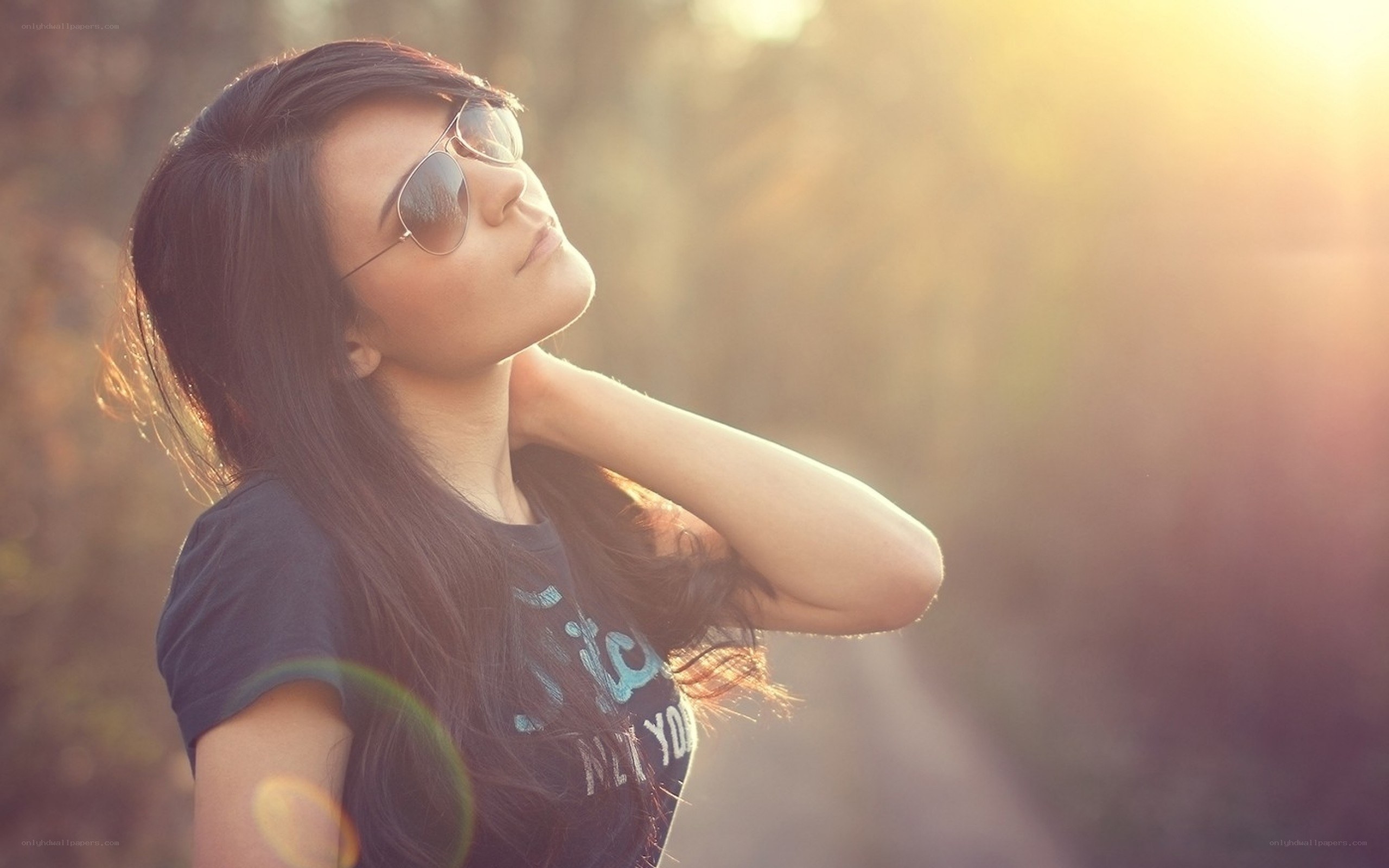 woman in sunglasses at sunset