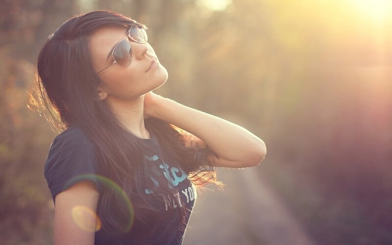 woman in sunglasses at sunset
