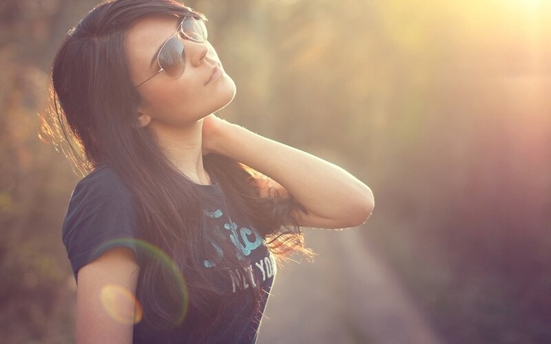 woman in sunglasses at sunset