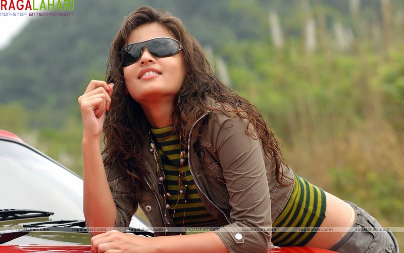 woman in sunglasses by car