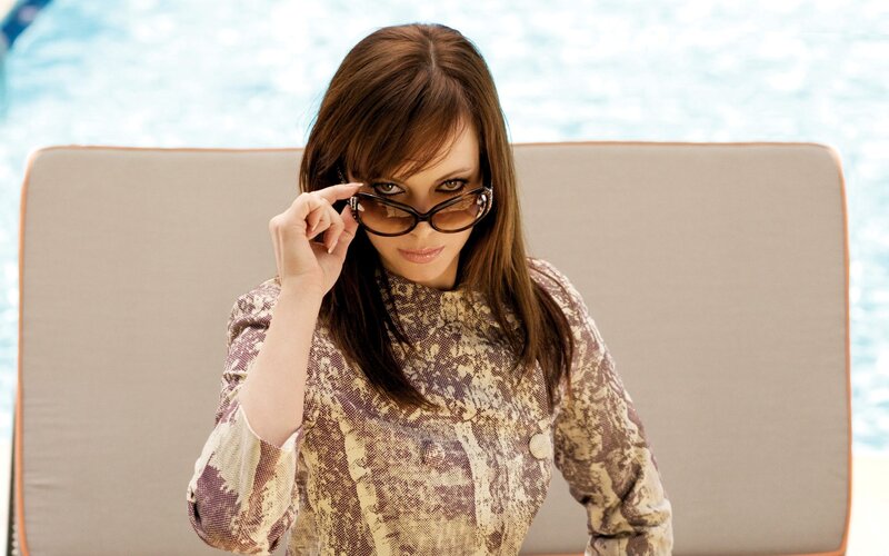 woman in sunglasses by pool