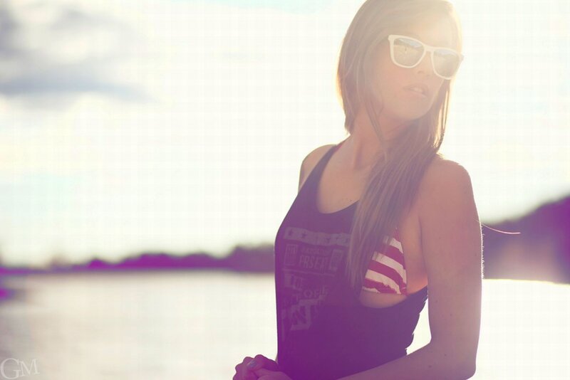 woman in sunglasses by water