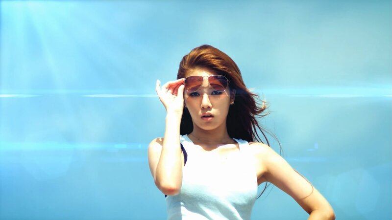 woman in sunglasses by water