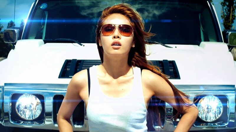 woman in sunglasses by white car