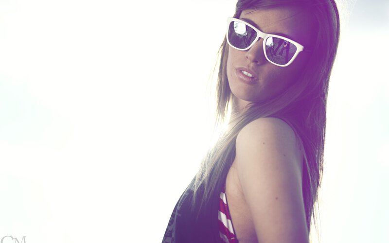 woman in sunglasses looking back