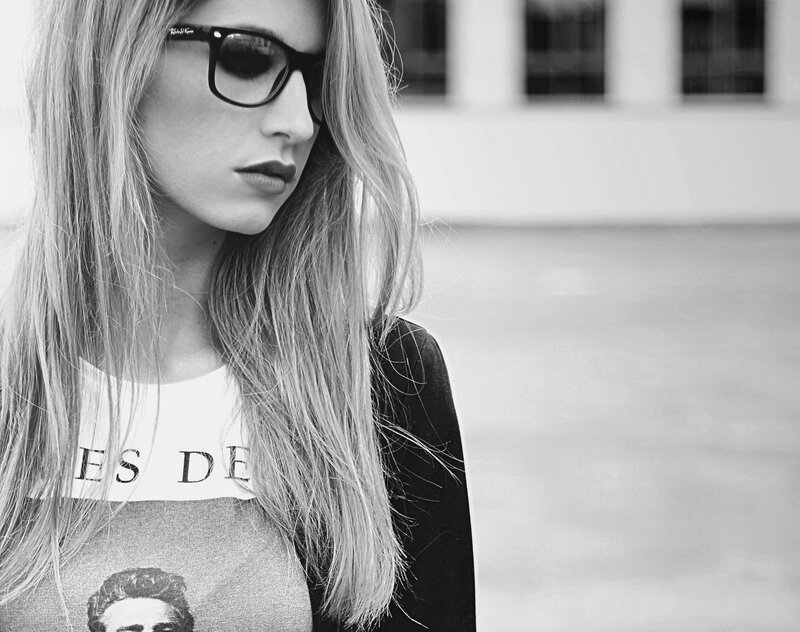 woman in sunglasses looking down