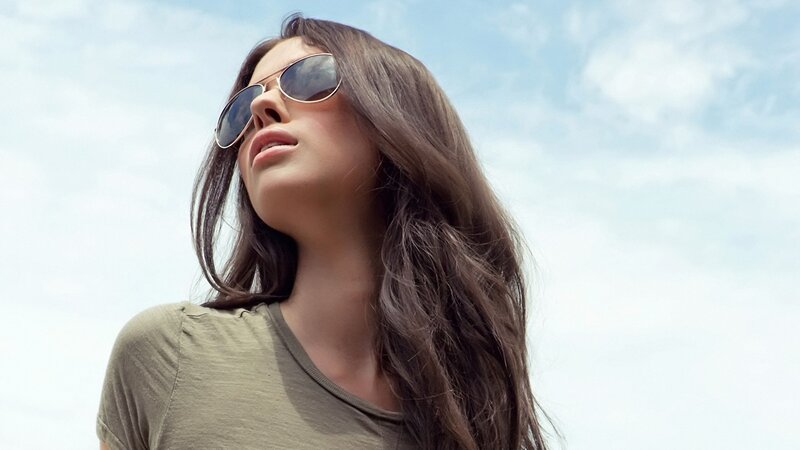 woman in sunglasses looking up