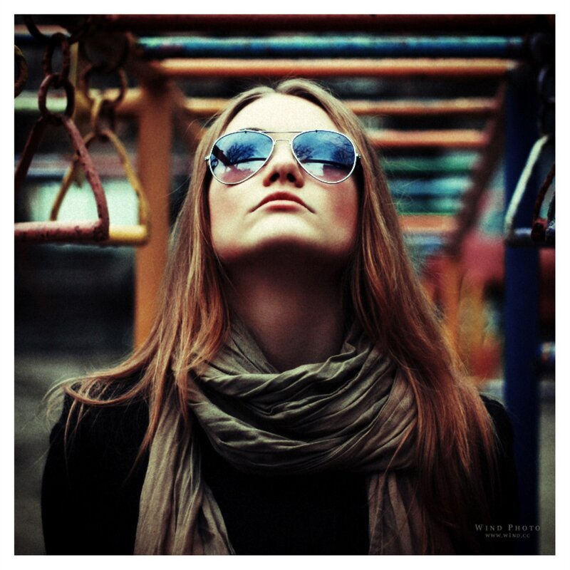 woman in sunglasses looking up