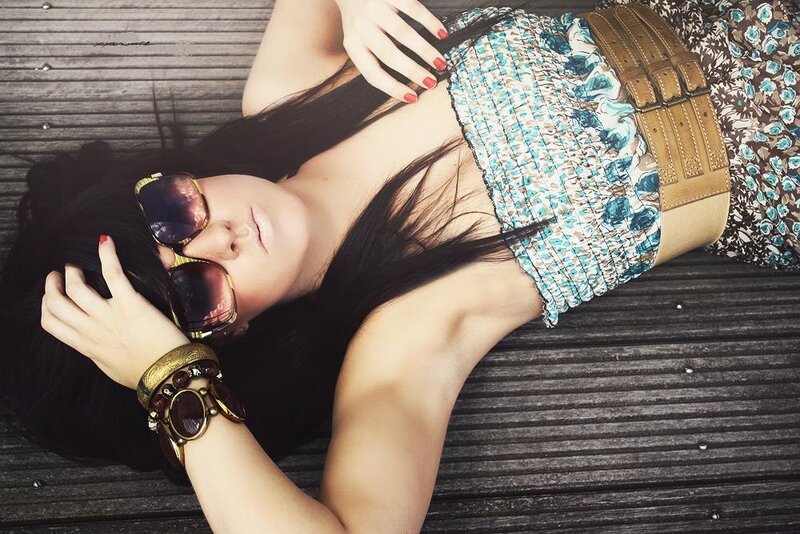 woman in sunglasses lying down