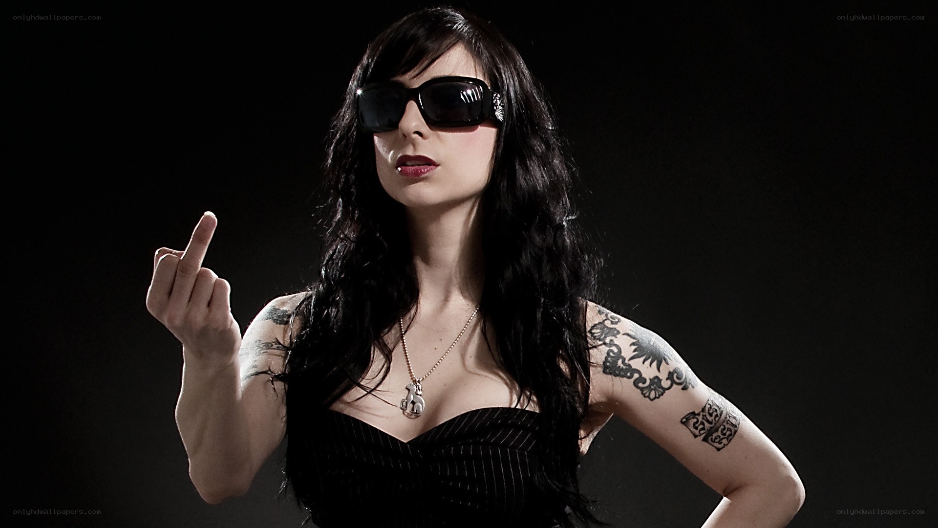 woman in sunglasses making gesture