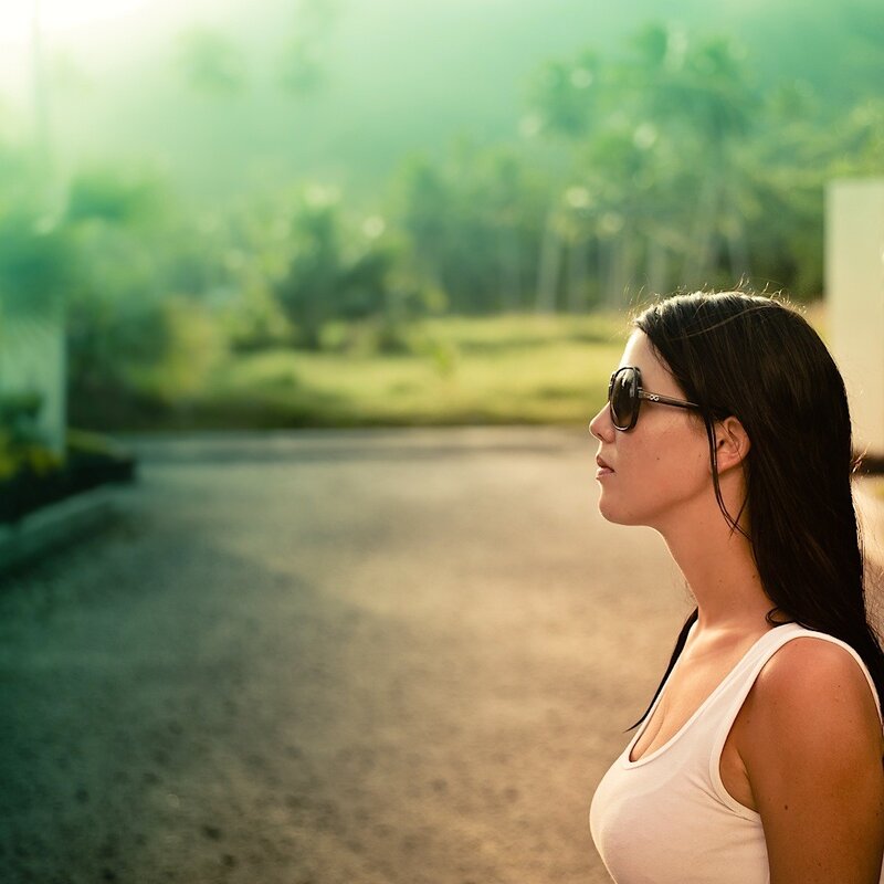 woman in sunglasses on a road