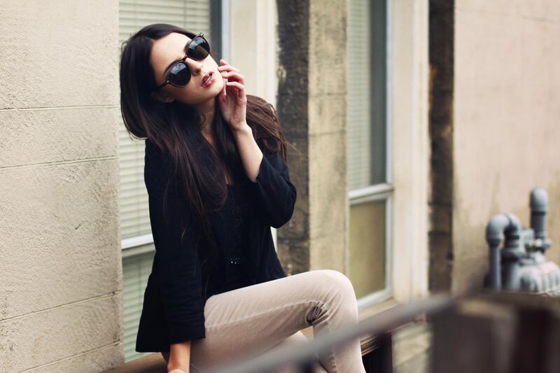 woman in sunglasses on balcony