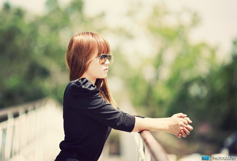 woman in sunglasses on bridge