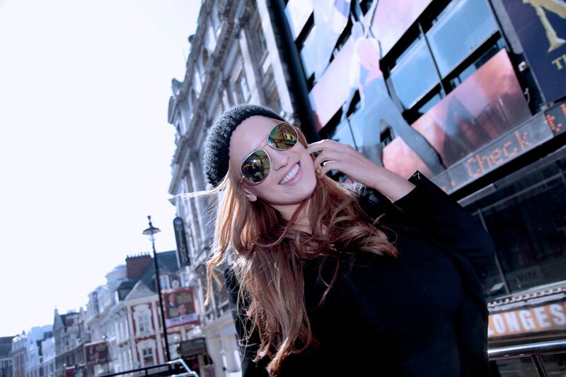 woman in sunglasses on city street