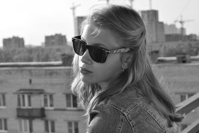 woman in sunglasses on rooftop