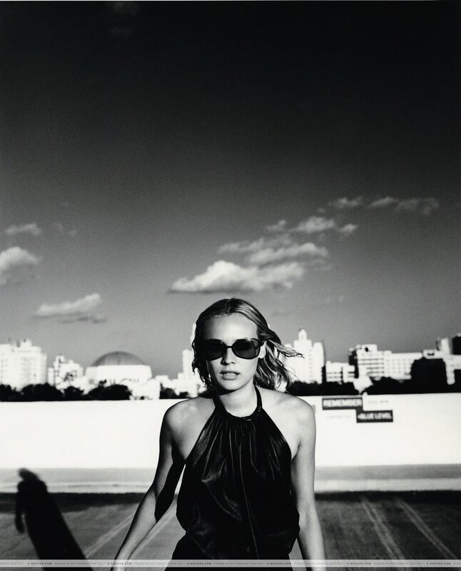 woman in sunglasses on rooftop