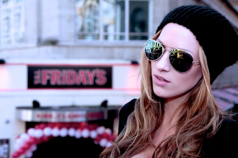 woman in sunglasses outside restaurant