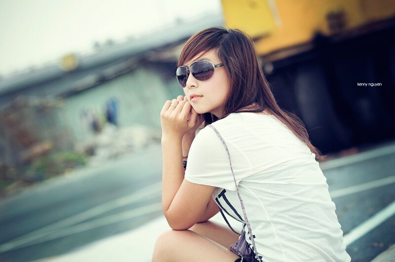 woman in sunglasses sitting