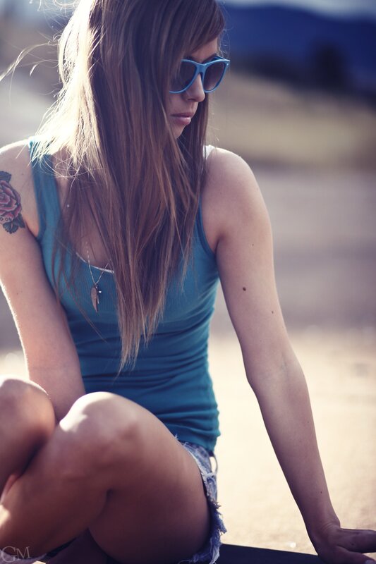woman in sunglasses sitting outside