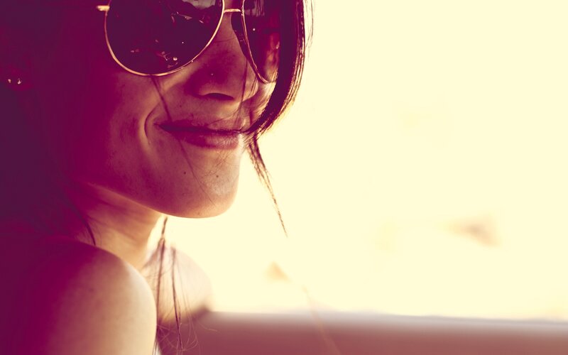 woman in sunglasses smiling