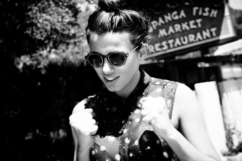 woman in sunglasses smiling