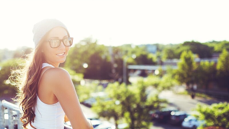 woman in sunglasses smiling