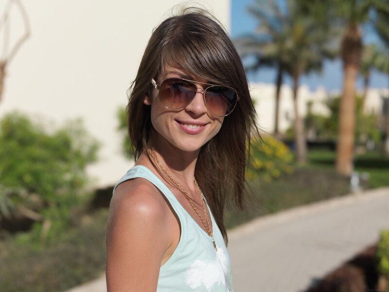 woman in sunglasses smiling
