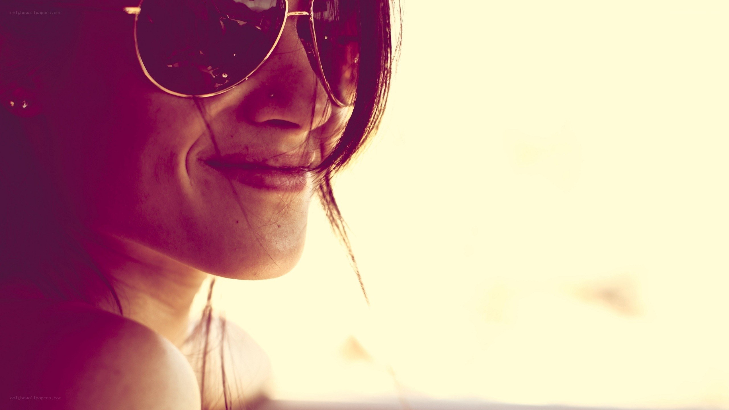 woman in sunglasses smiling