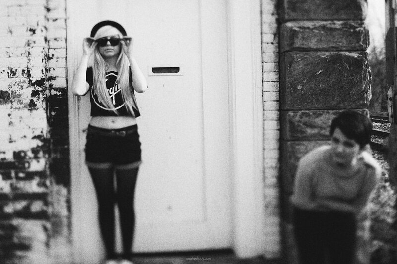 woman in sunglasses standing by door