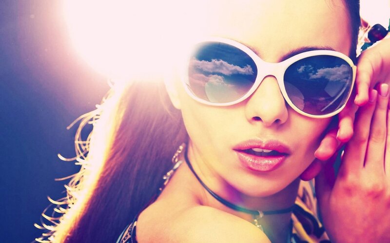 woman in sunglasses with sun flare