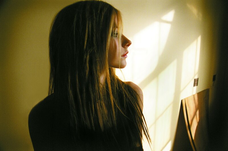 woman in sunlight by window