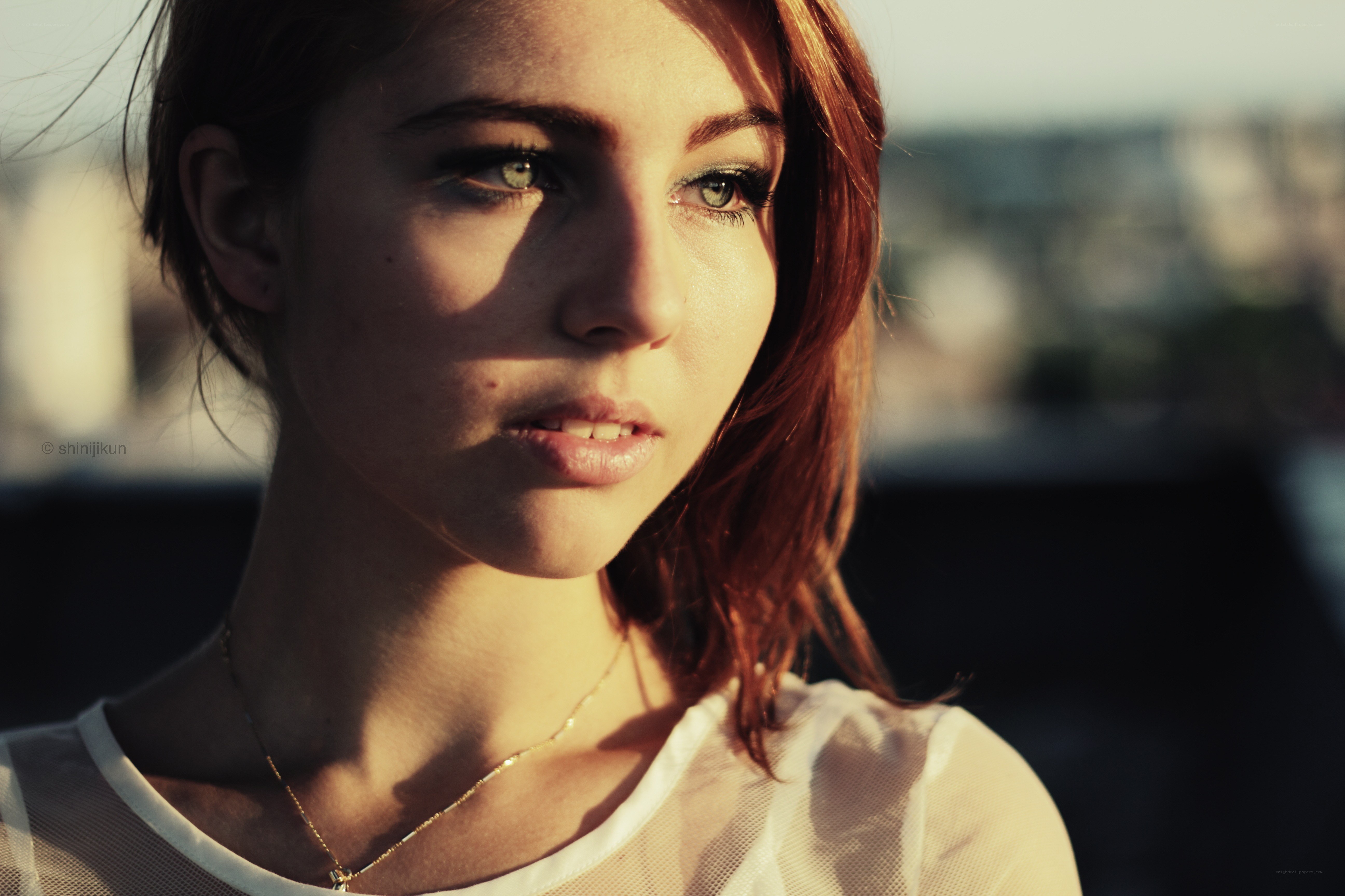 woman in sunlight on rooftop