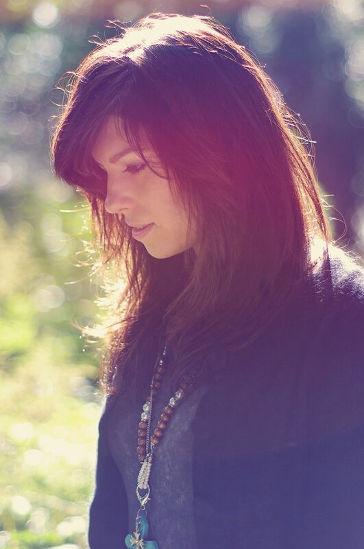 woman in sunlight with beads