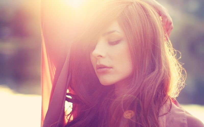 woman in sunlight with closed eyes